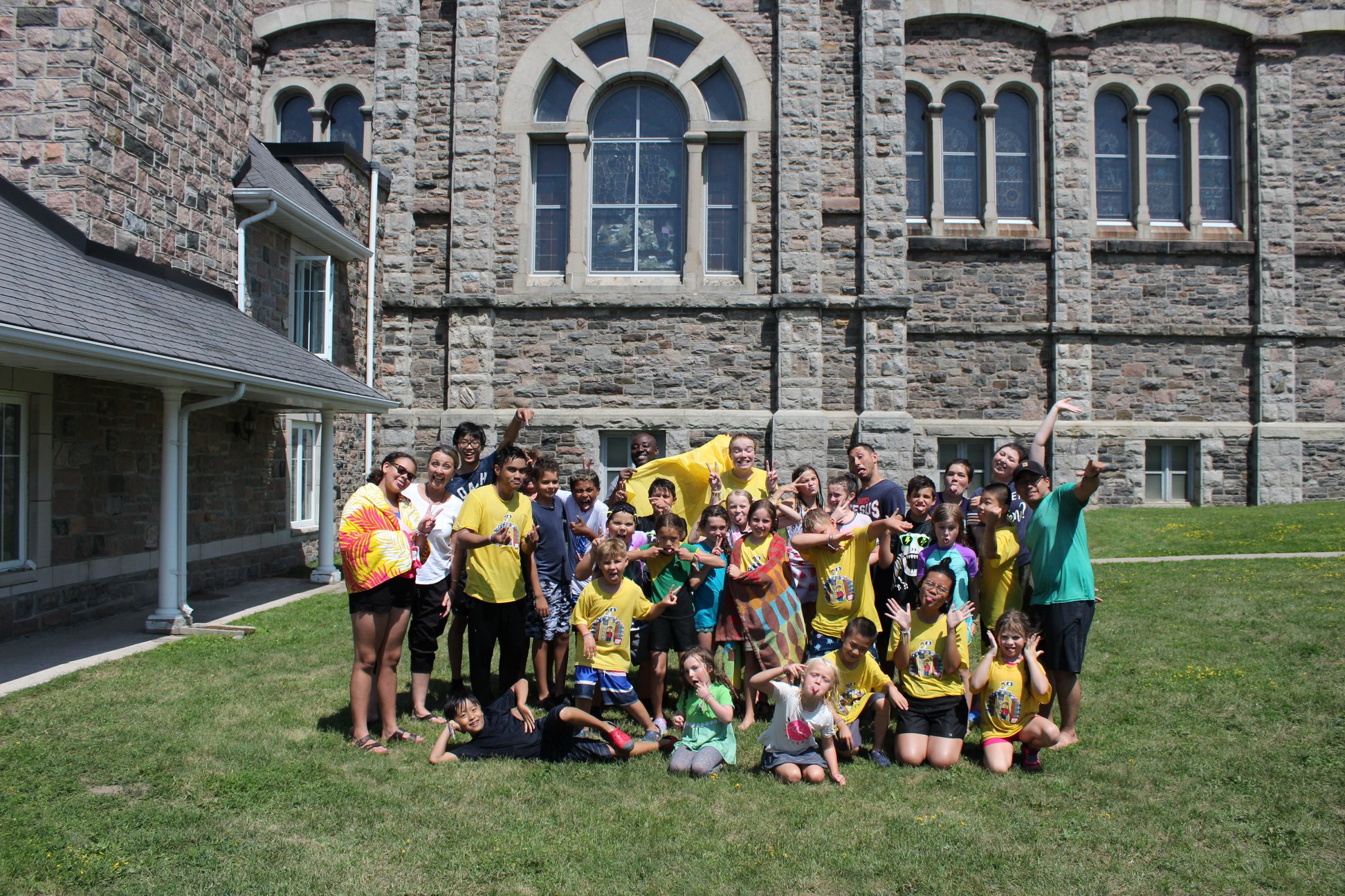 Group photo of campers at the end of the week of Totus Tuus Summer Camp after the Friday Water/ Slime Fight